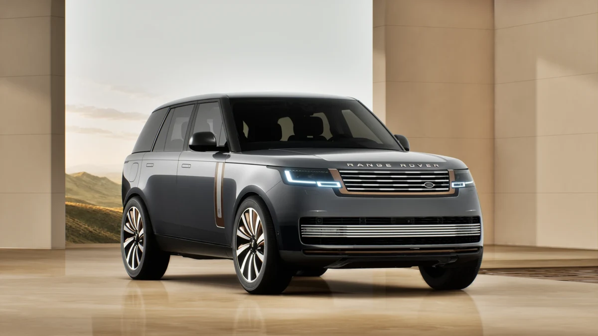 Full silver Range Rover SV vehicle in a bright architectural setting